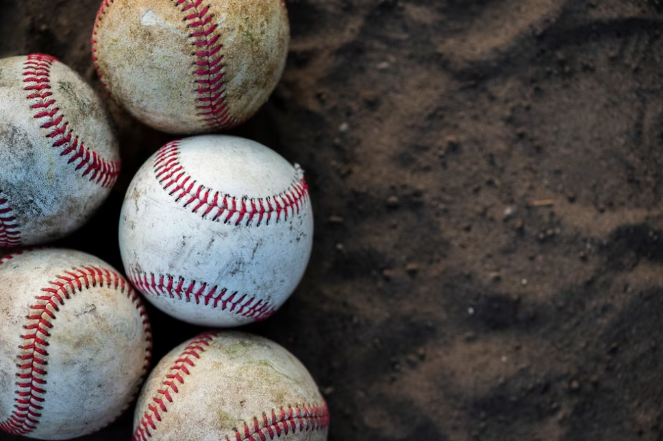 close-up of dirty baseballs on the sand