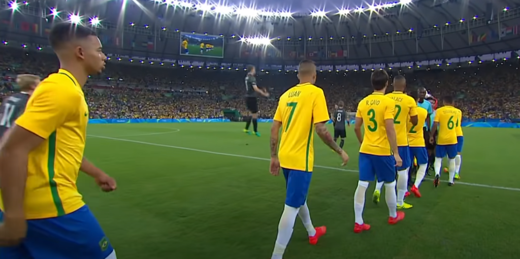 Soccer player in yellow uniform on the soccer field